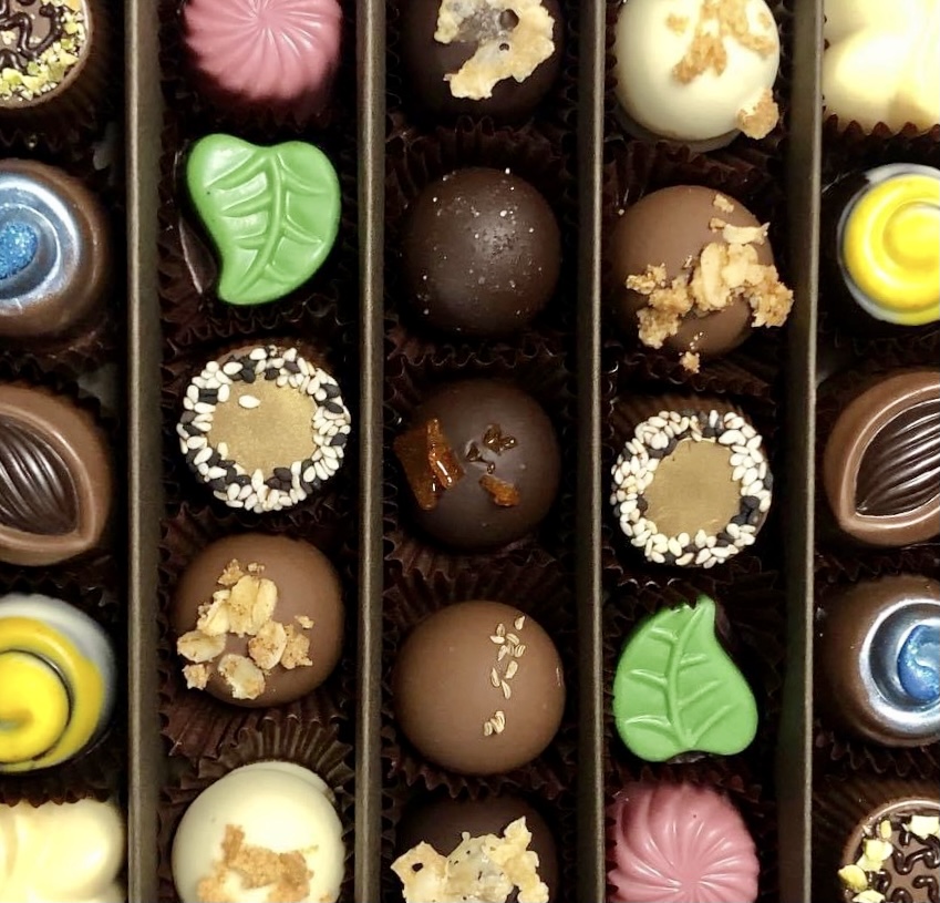 Close up of individual chocolate truffles in a box 